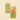 A segmented pistachio chocolate bar featuring whole nuts, set beside packaging adorned with scattered whole pistachios. - AI generated text