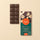 Segmented dark Gianduia chocolate bar with crunchy Piedmont PGI hazelnuts, presented beside its elegant packaging. - AI generated text