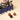 Venchi Vintage Dream Train tin holding Cream & Crunchy chocolates, with two milk and one dark chocolate sphere. - AI generated text