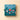 Vintage Dream Deluxe Gift Box: A refined teal square box adorned with festive ornaments, a rocking horse, and Venchi logo. - AI generated text