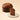 A whole 750g Chocoviar Dark Chocolate Panettone beside a single slice on a white plate. - AI generated text